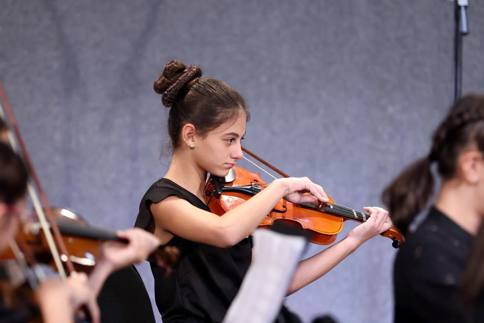 A young musician playing the violin